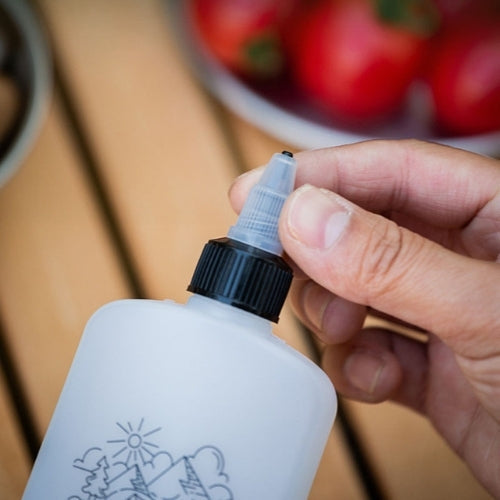 Bouteille distributrice d'huile